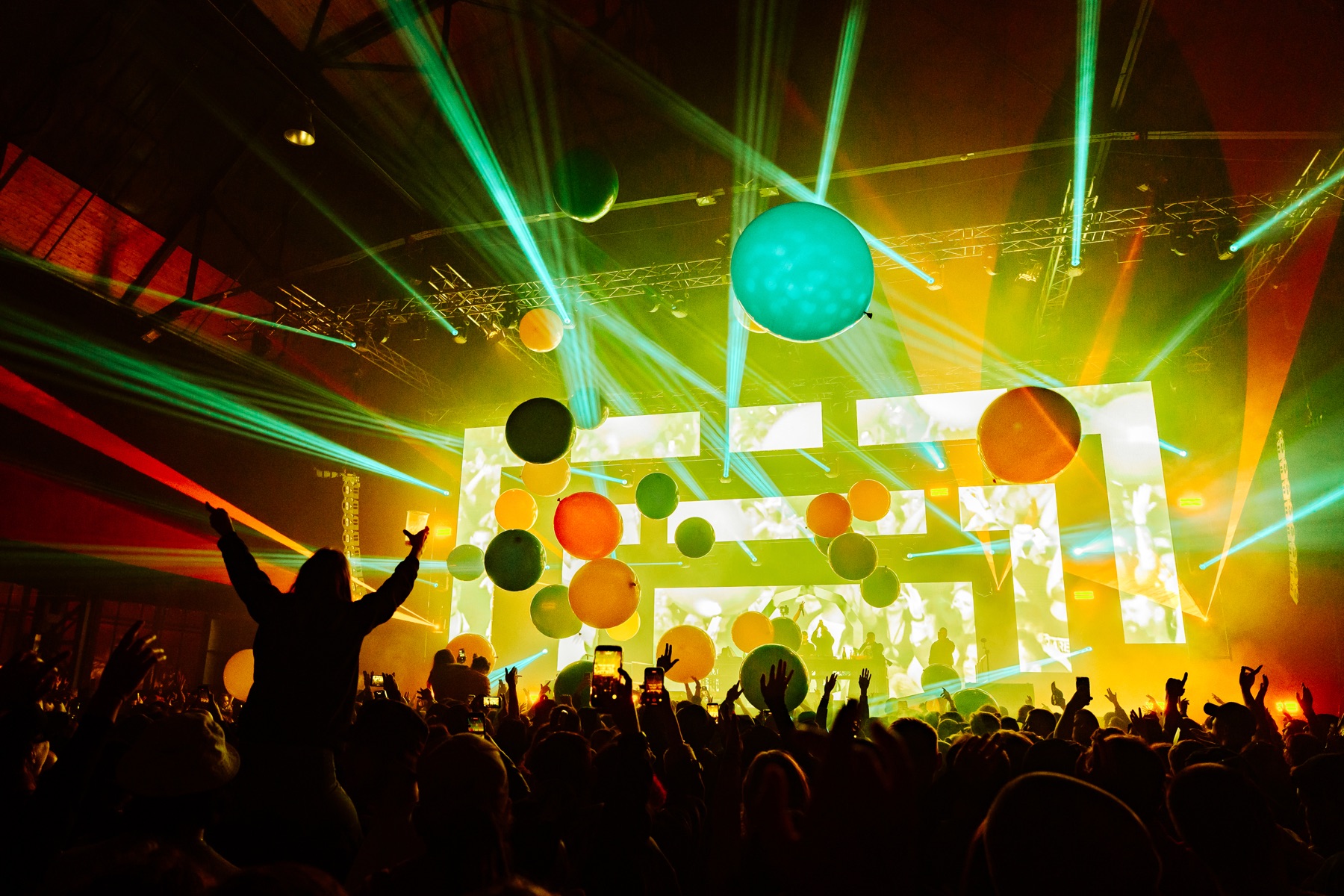 BASSIZM — colourful balloons and lasers above the crowd